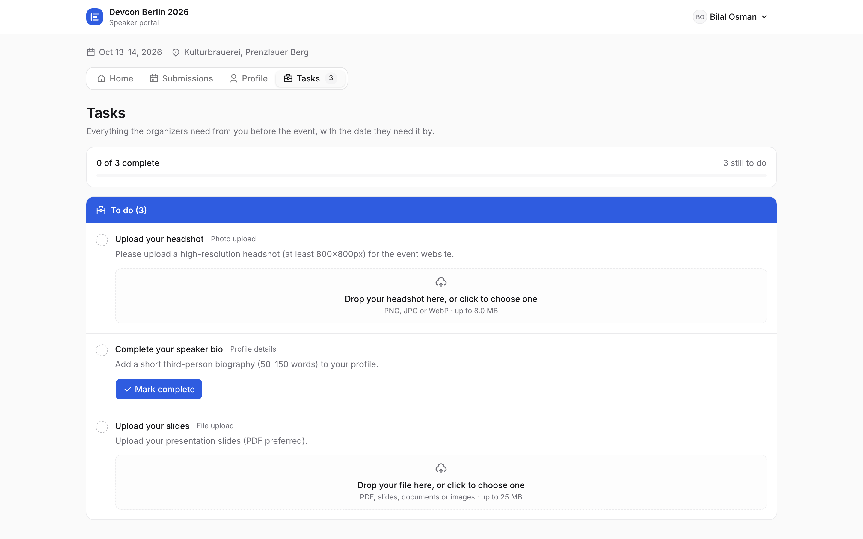 The speaker portal Tasks tab with the headshot-and-bio task the organizer assigned
